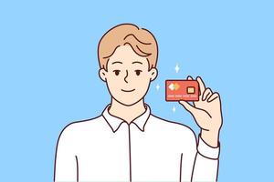 un jeune homme souriant montre une carte de débit ou de crédit bancaire en plastique. client masculin heureux ou client posant avec une nouvelle carte émise. illustration vectorielle. vecteur