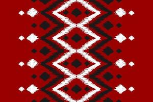 bel art de motif tribal ethnique. modèle sans couture rouge ikat ethnique. style américain et mexicain. vecteur