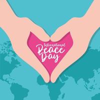 journée internationale de la paix lettrage avec les mains en forme de coeur vecteur