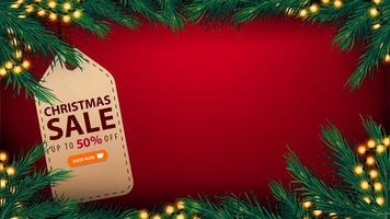 vente de Noël, jusqu'à 50 de réduction, modèle rouge de bannière de réduction avec espace de copie, cadre de guirlande, cadre en branches d'arbre de Noël et grande étiquette de prix avec offre et bouton vecteur