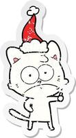 affligé autocollant dessin animé de une nerveux chat portant Père Noël chapeau vecteur