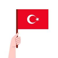 prier pour Turquie. dinde est en dessous de tremblement de terre. main détient une drapeau Turquie. vecteur dessin animé illustration.