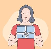 vacances, cadeau, concept de célébration. jeune heureuse sortie jolie femme brune tenant une boîte-cadeau. illustration de cadeau de Noël ou d'anniversaire de nouvel an. vecteur