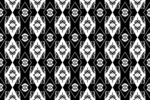 sans couture batik motif, géométrique tribal motif, il ressemble ethnique bohème, aztèque style, ikat style.luxe décoratif en tissu noir et blanc sans couture modèle pour célèbre bannières. vecteur