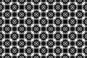 sans couture batik motif, géométrique tribal motif, il ressemble ethnique bohème, aztèque style, ikat style.luxe décoratif en tissu noir et blanc sans couture modèle pour célèbre bannières. vecteur