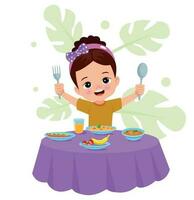 une garçon est en mangeant une repas avec une fourchette et cuillère. vecteur