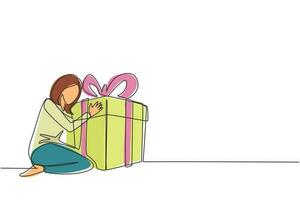 une seule ligne dessinant une femme caucasienne joyeuse étreignant un énorme cadeau d'anniversaire. jeune femme satisfaite assise près d'une boîte cadeau d'anniversaire enveloppée avec ruban. ligne continue dessin illustration vectorielle de conception vecteur