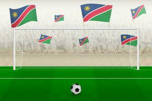 Namibie Football équipe Ventilateurs avec drapeaux de Namibie applaudissement sur stade, peine donner un coup concept dans une football correspondre. vecteur