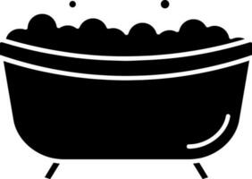 baignoire icône ou symbole dans glyphe style. vecteur