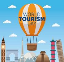 célébration de lettrage de la journée mondiale du tourisme avec des ballons à air chaud et des monuments vecteur