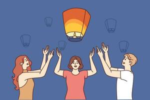 copains lancement chinois air lanternes ensemble à faire souhait pendant de fête nuit festival. homme et deux femmes élever mains en haut permanent près en volant chinois lanternes éclairant soir ciel vecteur