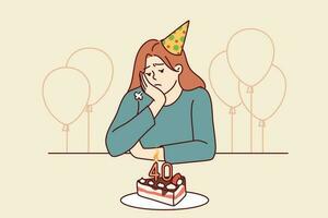 solitaire femme à anniversaire fête avec gâteau et des ballons est triste dû à approche de vieux âge ou manquer de de amis. affligé fille dans anniversaire chapeau est assis à de fête table et Besoins psychologique soutien vecteur