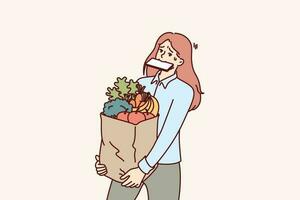 femme porte achats sac et détient téléphone dans bouche après de retour de épicerie marché avec biologique aliments. fille acheté lot de en bonne santé nourriture et est en essayant à apporter biologique des légumes et des fruits sur posséder vecteur