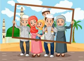 famille heureuse tenant un cadre photo avec mosquée sur le fond vecteur