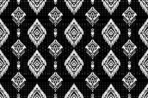 ornement folklorique géométrique ikat. texture vectorielle ethnique tribale. motif rayé sans couture dans le style aztèque. figure broderie tribale. indien, scandinave, gyp sy, mexicain, folk pattern.ikat pattern vecteur