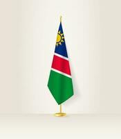 Namibie drapeau sur une drapeau rester. vecteur
