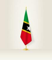 Saint kitts et nevis drapeau sur une drapeau rester. vecteur