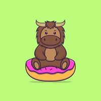 taureau mignon est assis sur des beignets. concept de dessin animé animal isolé. peut être utilisé pour un t-shirt, une carte de voeux, une carte d'invitation ou une mascotte. style cartoon plat vecteur