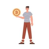 une homme détient une bitcoin dans le forme de une pièce de monnaie dans le sien mains. personnage avec une moderne style. vecteur