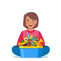 content fille enfant en portant jouet boîte plein de jouets. cubes, toupie, canard, Balle hochet, pyramide, tuyau, ours, balle, fusée, tambourin, bateau. vecteur illustration.