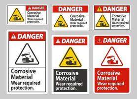 signe de danger matériaux corrosifs, porter la protection requise vecteur