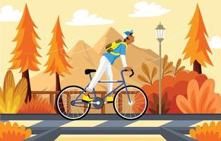 faire du vélo en automne vecteur