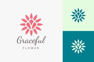 spa de beauté ou logo de yoga dans un logo de fleur plat et abstrait vecteur