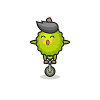 le mignon personnage durian fait du vélo de cirque vecteur