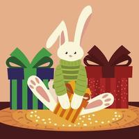 joyeux noël lapin mignon avec pull et cadeaux vecteur