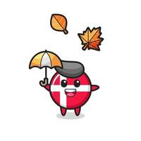 dessin animé de l'insigne mignon du drapeau du danemark tenant un parapluie en automne vecteur