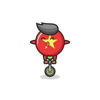 le mignon personnage insigne du drapeau vietnamien fait du vélo de cirque vecteur