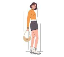 Jeune magnifique dessin animé mode modèle femme posant. vecteur isolé plat fille dans une jupe et bottes avec Sac à main.