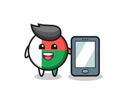 dessin animé d'illustration d'insigne de drapeau de madagascar tenant un smartphone vecteur