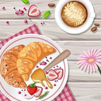 croissant de petit déjeuner avec des fruits et une tasse de café sur la table vecteur