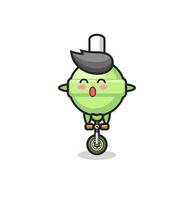 le mignon personnage de sucette fait du vélo de cirque vecteur