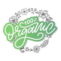 lettrage de brosse organique. mot dessiné à la main organique avec des feuilles vertes. étiquette, modèle de logo pour les produits biologiques, marchés alimentaires sains. vecteur
