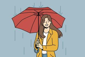 content femme avec parapluie des promenades dans pluie le long de l'automne rue et regards à écran avec large sourire vecteur