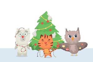 le tigre, le hibou et l'ours décorent le sapin de Noël vecteur