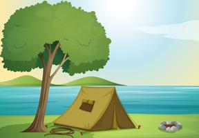un arbre et une tente vecteur