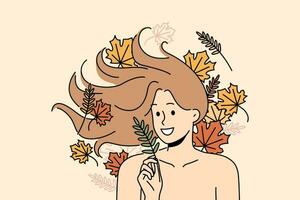 femme avec longue écoulement cheveux mensonges parmi l'automne feuilles et sourit réjouissance à début de septembre. femme avec nu épaules pour La publicité produits de beauté ou shampooing fabriqué sur base de herbes et les plantes vecteur