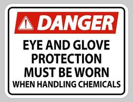 les signes de danger doivent porter des lunettes de protection et des gants lors de la manipulation de produits chimiques vecteur