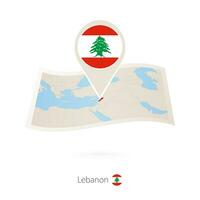 plié papier carte de Liban avec drapeau épingle de Liban. vecteur