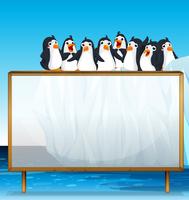 Cadre en bois avec des pingouins sur la glace vecteur
