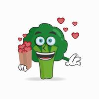 personnage de mascotte de brocoli tenant une icône d'amour. illustration vectorielle vecteur