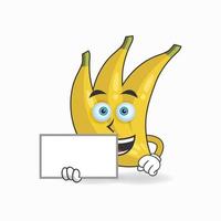 Mascotte de personnage banane tenant un tableau blanc. illustration vectorielle vecteur