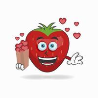 personnage de mascotte de fraise tenant une icône d'amour. illustration vectorielle vecteur