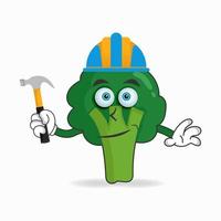 le personnage mascotte brocoli devient un bâtisseur. illustration vectorielle vecteur