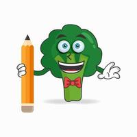 personnage de mascotte de brocoli tenant un crayon. illustration vectorielle vecteur