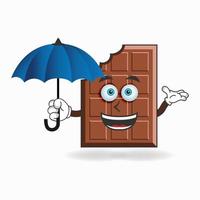 personnage de mascotte au chocolat tenant un parapluie. illustration vectorielle vecteur