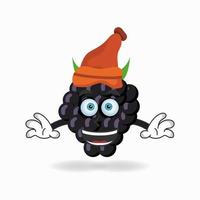 le personnage de mascotte de raisin coiffé d'un chapeau. illustration vectorielle vecteur